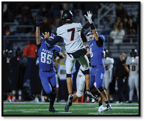 A group of football players wearing black jerseys with the number 3 on them. Description generated by AI