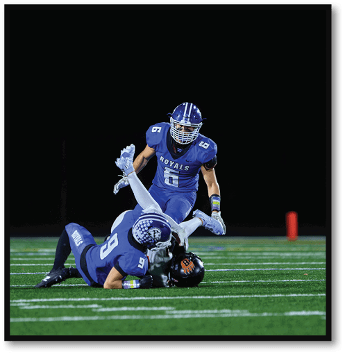 Two football players wearing black jerseys with the number 11 on them. Description generated by AI