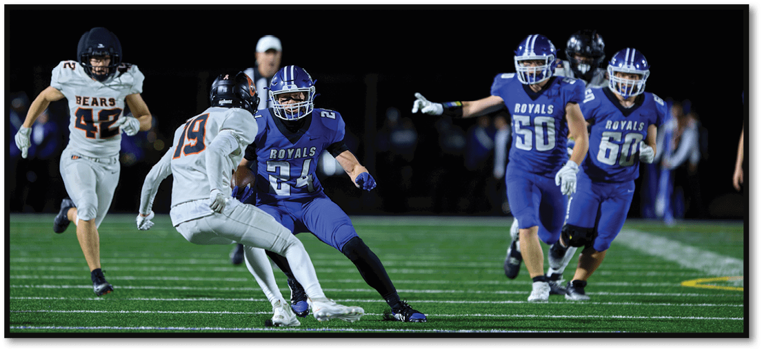 A football player running on the field. Description generated by AI