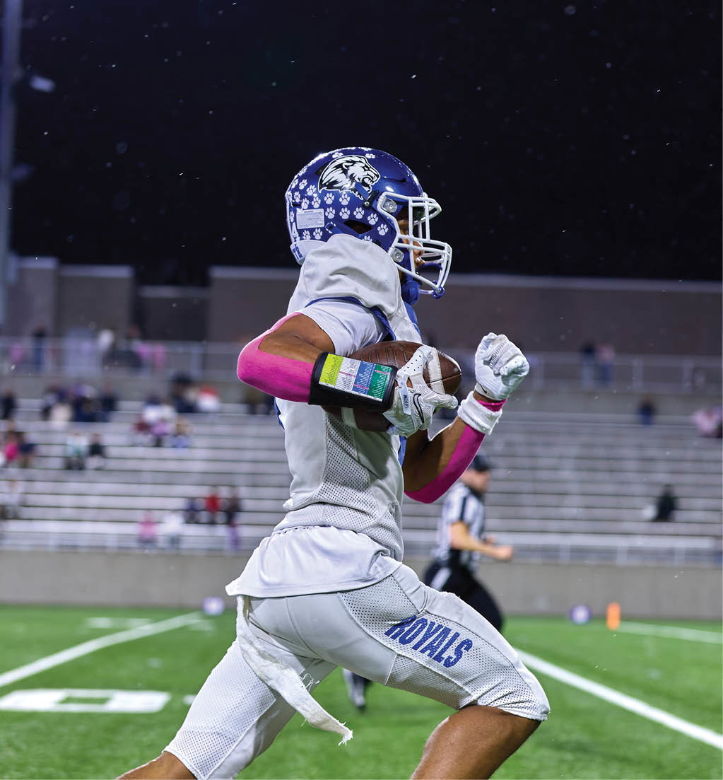 A football player in a white jersey with the number 16 on it. Description generated by AI