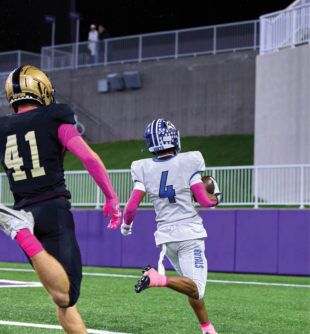 A football player in a white jersey with the number 16 on it. Description generated by AI