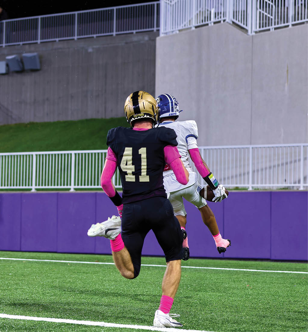 A football player in a white jersey with the number 16 on it. Description generated by AI
