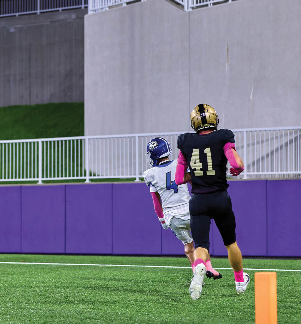 A football player in a white jersey with the number 16 on it. Description generated by AI