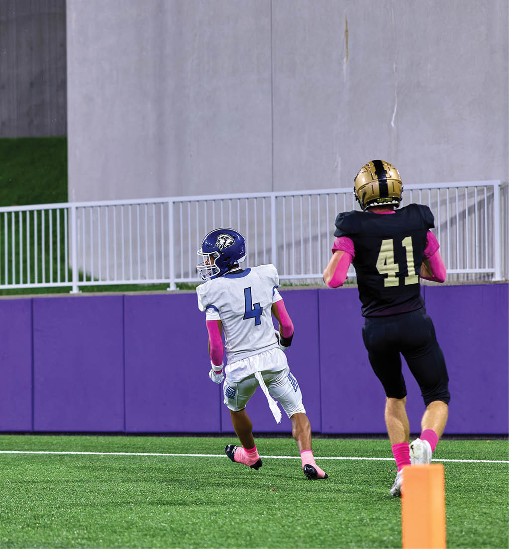 A football player in a white jersey with the number 16 on it. Description generated by AI