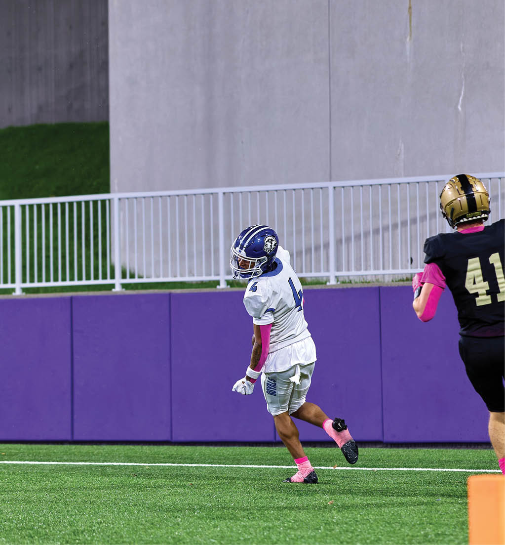 A football player in a white jersey with the number 16 on it. Description generated by AI