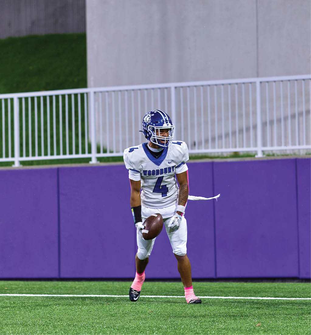 A football player in a white jersey with the number 16 on it. Description generated by AI