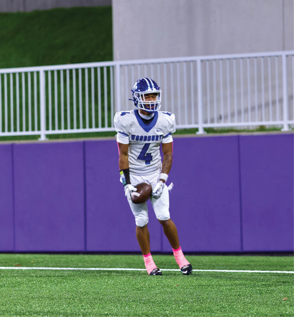 A football player in a white jersey with the number 16 on it. Description generated by AI