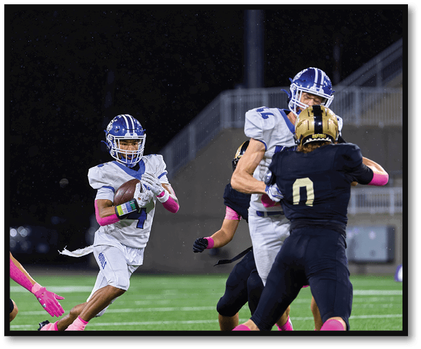 A football player is kicking a football on a field. Description generated by AI