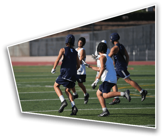 People wearing athletic gear and helmets are running and playing on a sports field. Description generated by AI