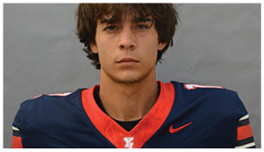 A close-up of a sports jersey with a red and navy blue color scheme featuring a white “YL" logo on the chest. Description generated by AI