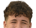 A person with short curly hair is smiling and wearing a navy blue football jersey with the word Mustangs and the number 97 in white and orange. Description generated by AI
