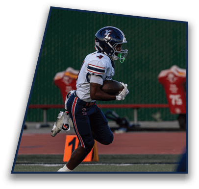 A person wearing a football uniform and helmet is running on a field while holding a football. Description generated by AI