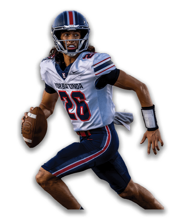 A person wearing a football uniform and helmet is holding a football and appears to be running or preparing to throw the ball. Description generated by AI