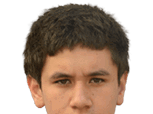 A person with short dark hair is looking directly at the camera with a neutral expression. Description generated by AI