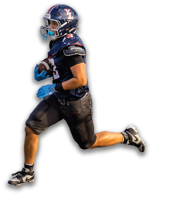 A person wearing a dark football uniform and helmet is running while holding a football. Description generated by AI