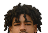 Person with curly, textured hair looking forward against a white background. Description generated by AI