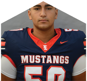 Person wearing a navy blue and red football jersey with the word Mustangs and the number 50 on the front. Description generated by AI