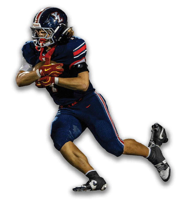 A person wearing a dark blue football uniform with red and white stripes is running while holding a football. Description generated by AI