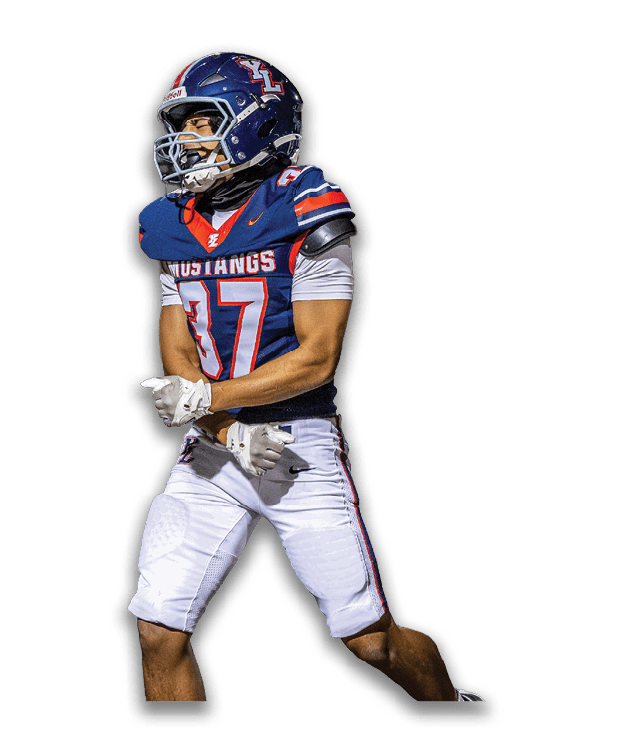 A person wearing a blue and white football uniform with the word Mustangs and the number 37 is standing with clenched fists and an intense expression. Description generated by AI