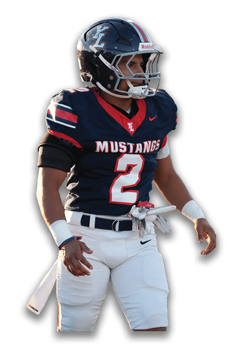 A person wearing a navy blue football uniform with the number two and the word Mustangs on the jersey is standing and looking to the side while wearing a helmet. Description generated by AI