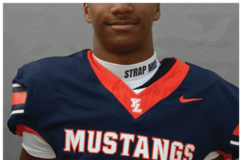 A person wearing a navy blue football jersey with red and white accents that says Mustangs and a white neck guard with the text Strap Mob. Description generated by AI