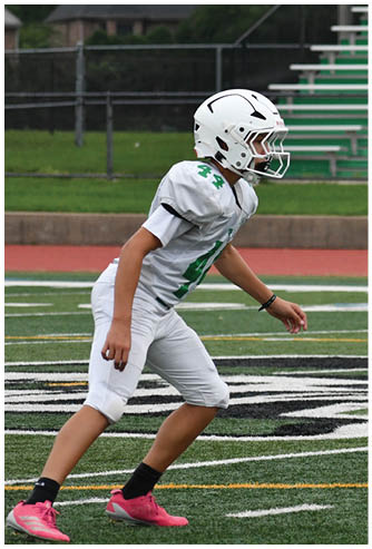 A football game is being played on a field. Description generated by AI