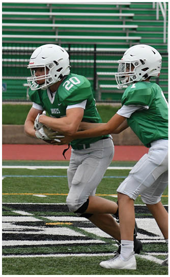 A football player catching a ball. Description generated by AI