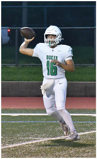 A football player catching a ball. Description generated by AI