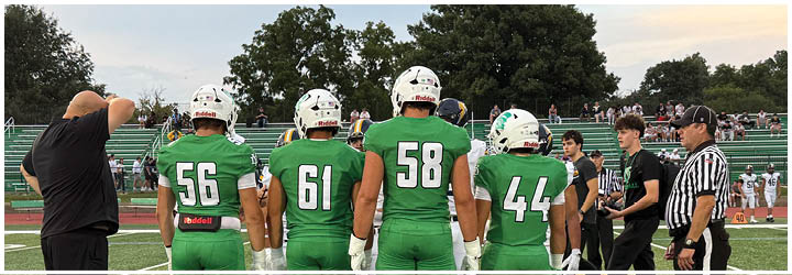 A group of football players on a field. Description generated by AI