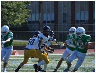 A group of football players on a field. Description generated by AI