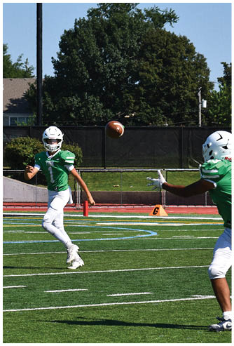 A football game is being played on a field. Description generated by AI