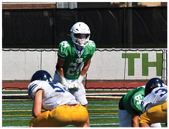 A group of football players on a field. Description generated by AI
