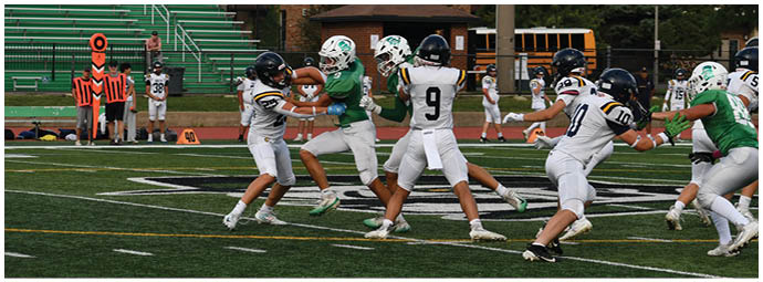 A football player wearing a blue and white uniform. Description generated by AI