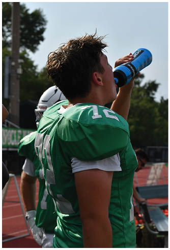A football game is being played on a field. Description generated by AI
