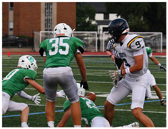 A group of football players on a field. Description generated by AI