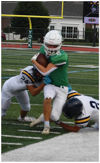 A football player catching a ball. Description generated by AI