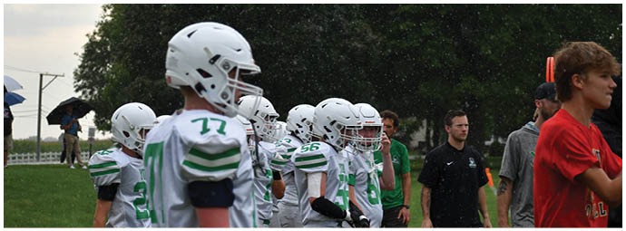 A football player wearing a blue and white uniform. Description generated by AI