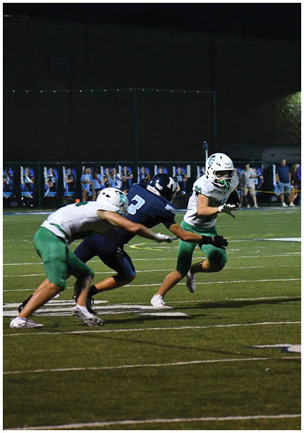 A football game is being played on a field. Description generated by AI