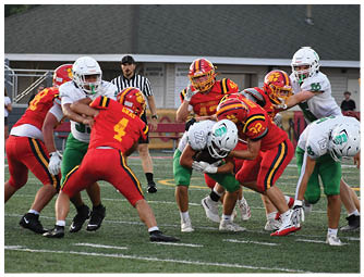 A group of football players on a field. Description generated by AI