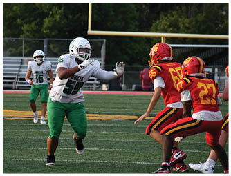 A group of football players on a field. Description generated by AI
