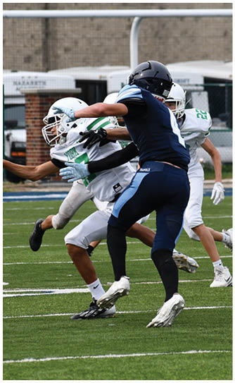 A football player catching a ball. Description generated by AI