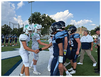 A group of football players on a field. Description generated by AI