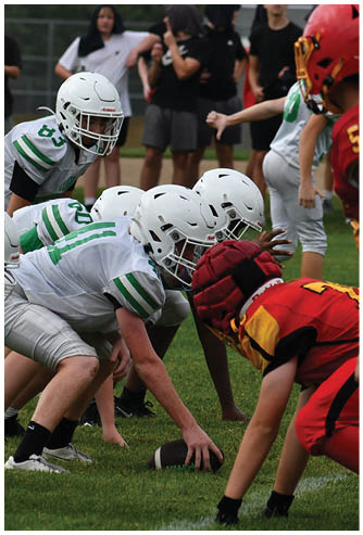 A football game is being played on a field. Description generated by AI