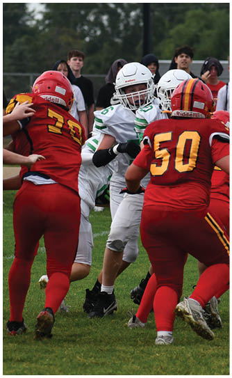 A football player catching a ball. Description generated by AI