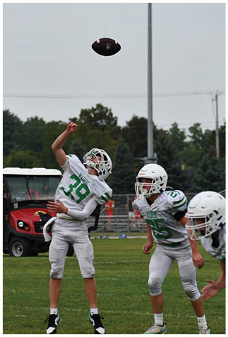 A football game is being played on a field. Description generated by AI