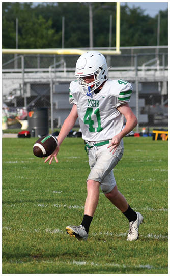 A football player catching a ball. Description generated by AI