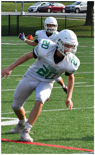 A football player catching a ball. Description generated by AI