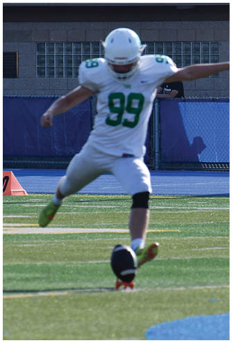 A football game is being played on a field. Description generated by AI