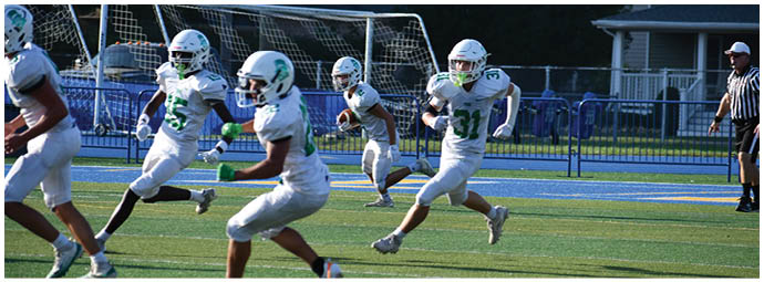 A football player wearing a blue and white uniform. Description generated by AI