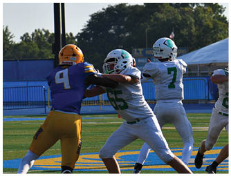 A group of football players on a field. Description generated by AI